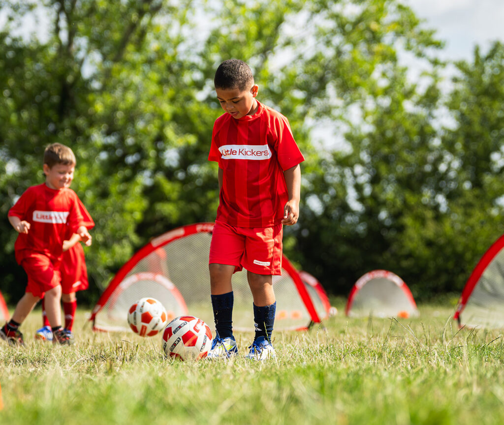 a group of kids playing football